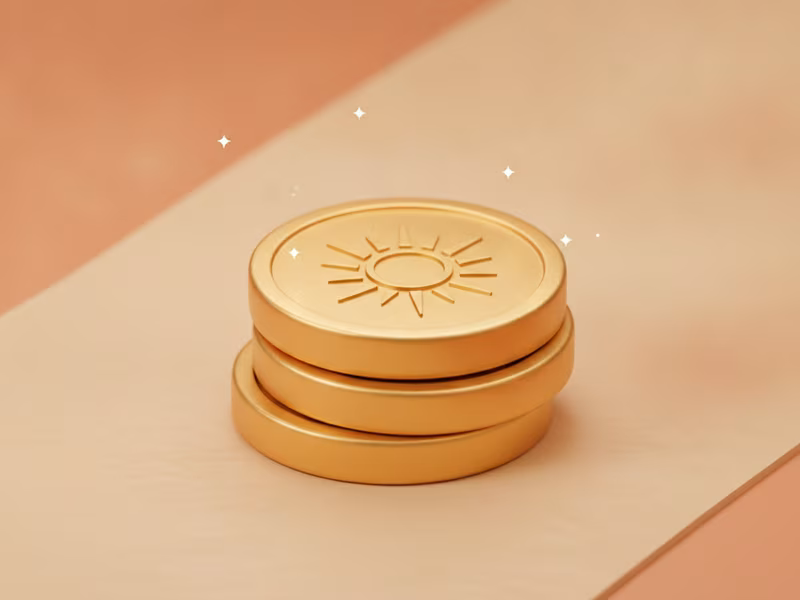 Small stack of golden Sun Coins in soft morning light